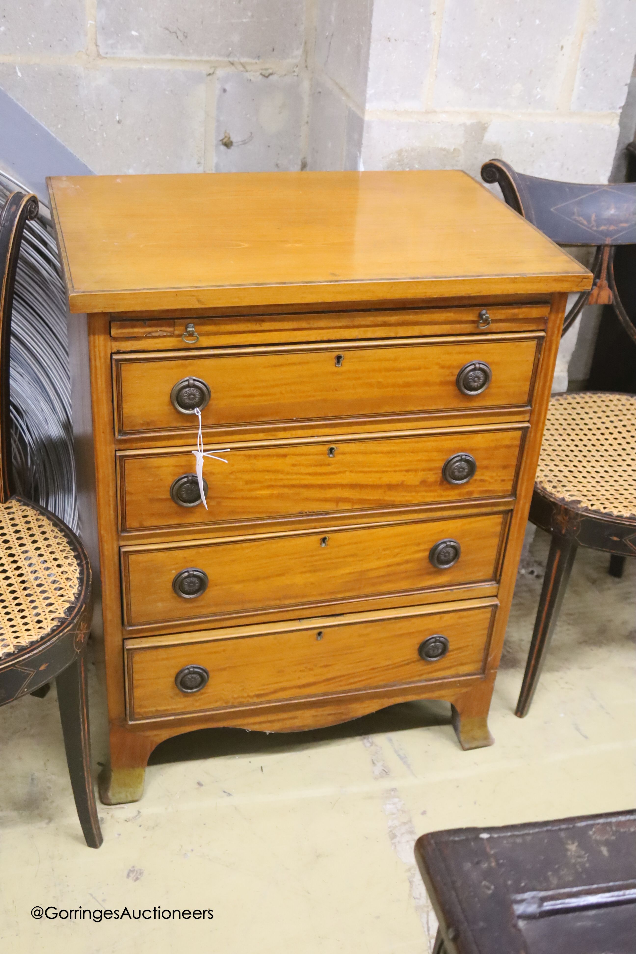A small late 19th/early 20th century satinwood chest with slide, width 64cm, depth 46cm, height 82cm